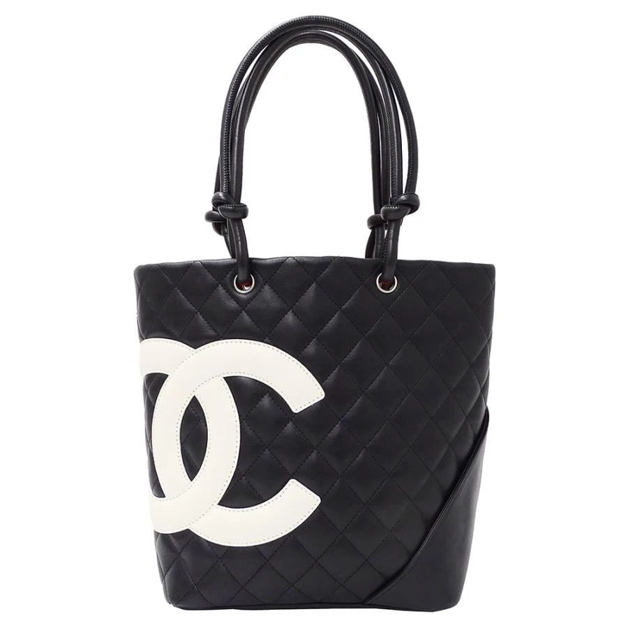 CHANEL LAMBSKIN CAMBON MEDIUM TOTE: Chanel Lambskin Cambon Medium Tote Brand: Chanel Type: Handbag Material: Lambskin Color: Black Size: W: 19.5cm (bottom) / H: 24.5cm / D: 11.5cm (bottom) / Handle: 46cm Accessories: None Accessories