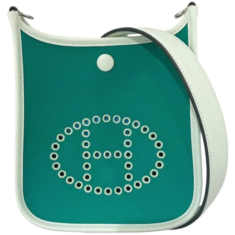 HERMES NEO EVELYNE SHOULDER BAG: HERMES Neo Evelyne Shoulder Bag Brand: HERMES Type: Handbag Material: Toile Color: Mint Veil Fizz Size: W: 16cm / H: 19cm / D: 5.5cm Accessories: None Accessories Notice: When purchasing p