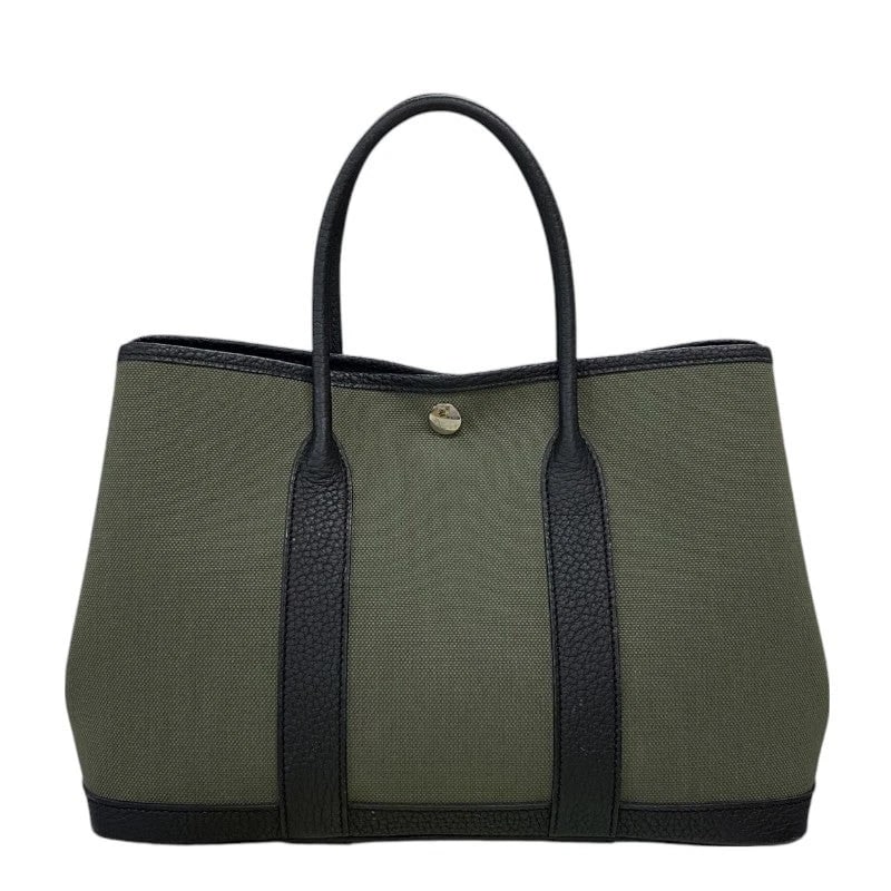 HERMES GARDEN PARTY TPM SHW TOILE: HERMES Garden Party TPM SHW Toile Brand: HERMES Type: Handbag Material: Toile Color: Khaki x Black / SV Hardware Size: W: 30cm / H: 21cm / D: 13.5cm Accessories: None Accessories Notice: W