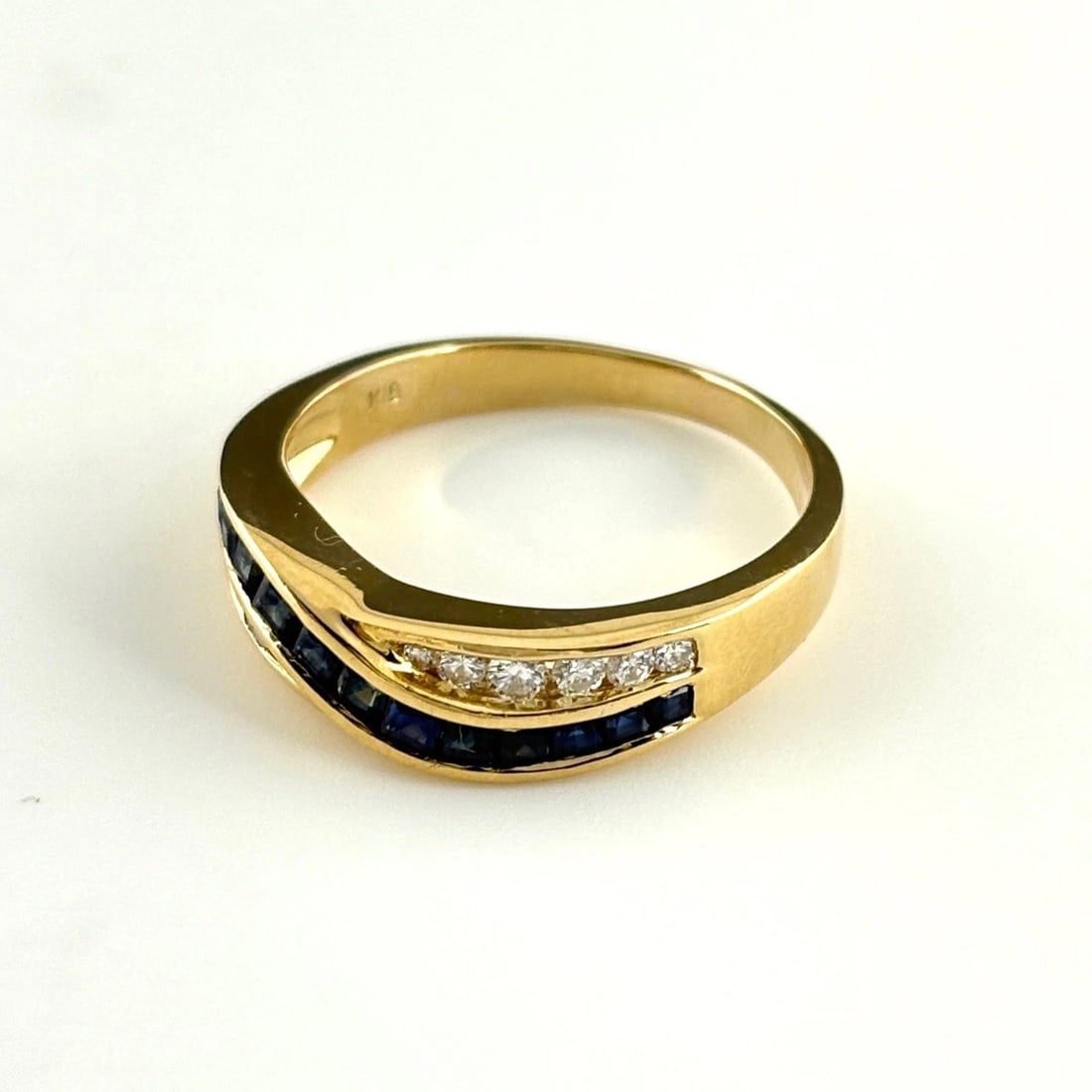 SAPPHIRE DESIGN RING YELLOW GOLD MELEE DIAMOND: Sapphire Design Ring Yellow Gold Melee Diamond Brand: Unbranded Type: Ring Material: 18K, Main Stone/Creation sapphire Color: YellowGold Size: US 7 to 7.5 Accessories: None Accessories Not
