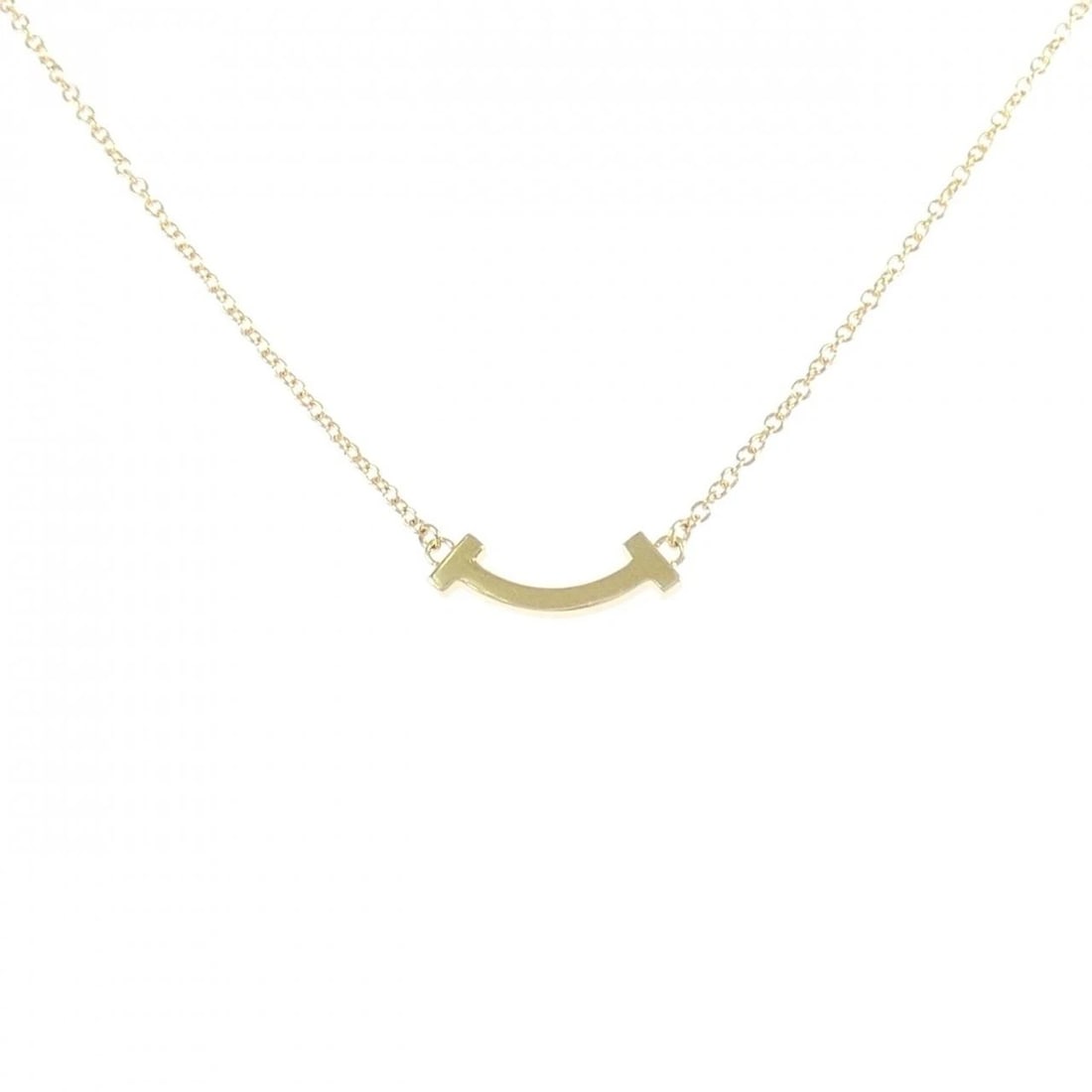 TIFFANY & CO. T SMILE MINI NECKLACE: TIFFANY & Co. T Smile Mini Necklace Brand: TIFFANY&Co. Type: TIFFANY&Co. Necklace Material: 750 yellow gold, Color: yellow gold Size: Actual Size Pendant length approx. x width approx.: 3.6mmx13.5mm