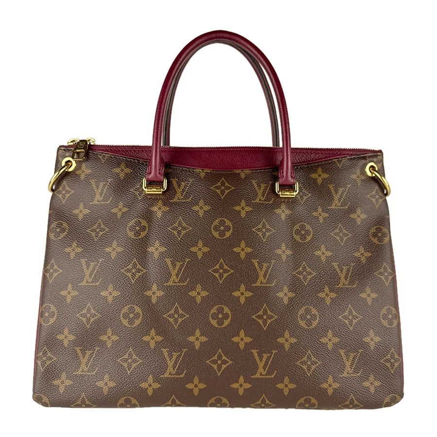 LOUIS VUITTON MONOGRAM PALAIS HANDBAG: LOUIS VUITTON Monogram Palais Handbag Brand: LOUIS VUITTON Type: Handbag Material: Monogram Canvas Color: Raisin Size: W:13.4inx H:9.8inx D:5.1in Handle Length:15.0in Accessories: None Acc