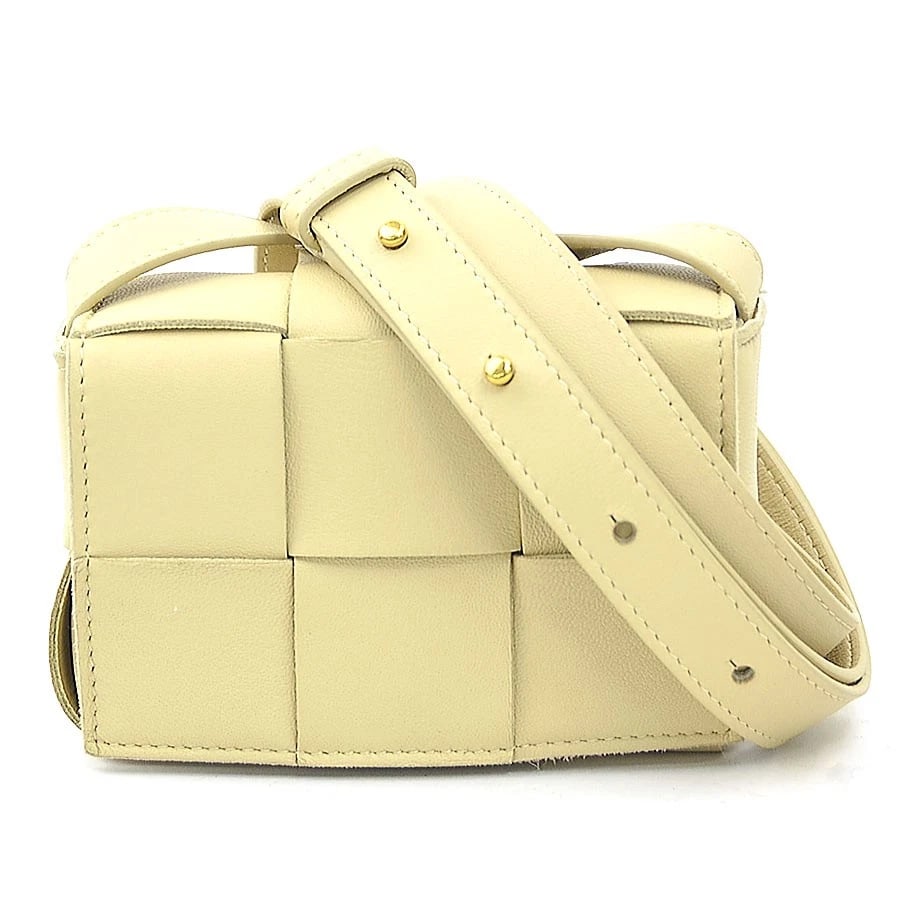 BOTTEGAVENETA CANDY CASSETTE SHOULDER BAG: BOTTEGAVENETA Candy Cassette Shoulder Bag Brand: BOTTEGAVENETA Type: Shoulder Bag Material: Leather Color: Beige Size: W:4.9inx H:3.5inx D:1.8in Accessories: None Accessories Notice: When