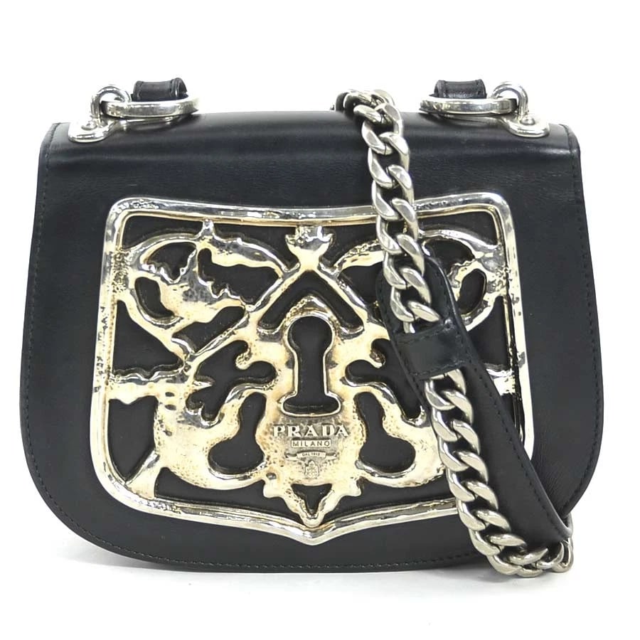 PRADA SHOULDER BAG BLACK/SILVER LEATHER/METAL: PRADA Shoulder Bag Black/Silver Leather/Metal Brand: PRADA Type: Shoulder Bag Material: Leather/Metal Color: Black Size: W:6.9inx H:5.5inx D:1.6in Accessories: None Accessories Notice: Whe