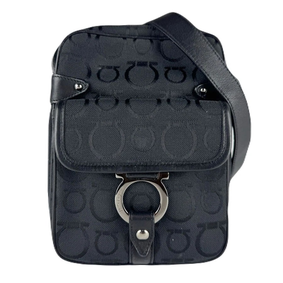 SALVATORE FERRAGAMO GANCINI CROSSBODY SHOULDER BAG: Salvatore Ferragamo Gancini Crossbody Shoulder Bag Brand: Salvatore Ferragamo Type: Crossbody Shoulder Bag Material: Canvas/Leather Color: Black Size: W:5.9inx H:7.9inx D:2.0in Accessories: None <