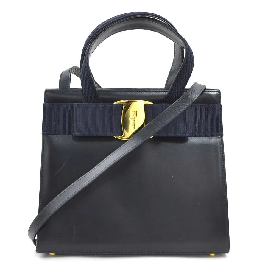 SALVATORE FERRAGAMO VARA RIBBON HANDBAG SHOULDER BAG: Salvatore Ferragamo Vara Ribbon Handbag Shoulder Bag Brand: Salvatore Ferragamo Type: Handbag Material: leather Color: Navy Size: W:9.6inx H:8.3inx D:3.7in Handle Length:11.0in Accessories: None <