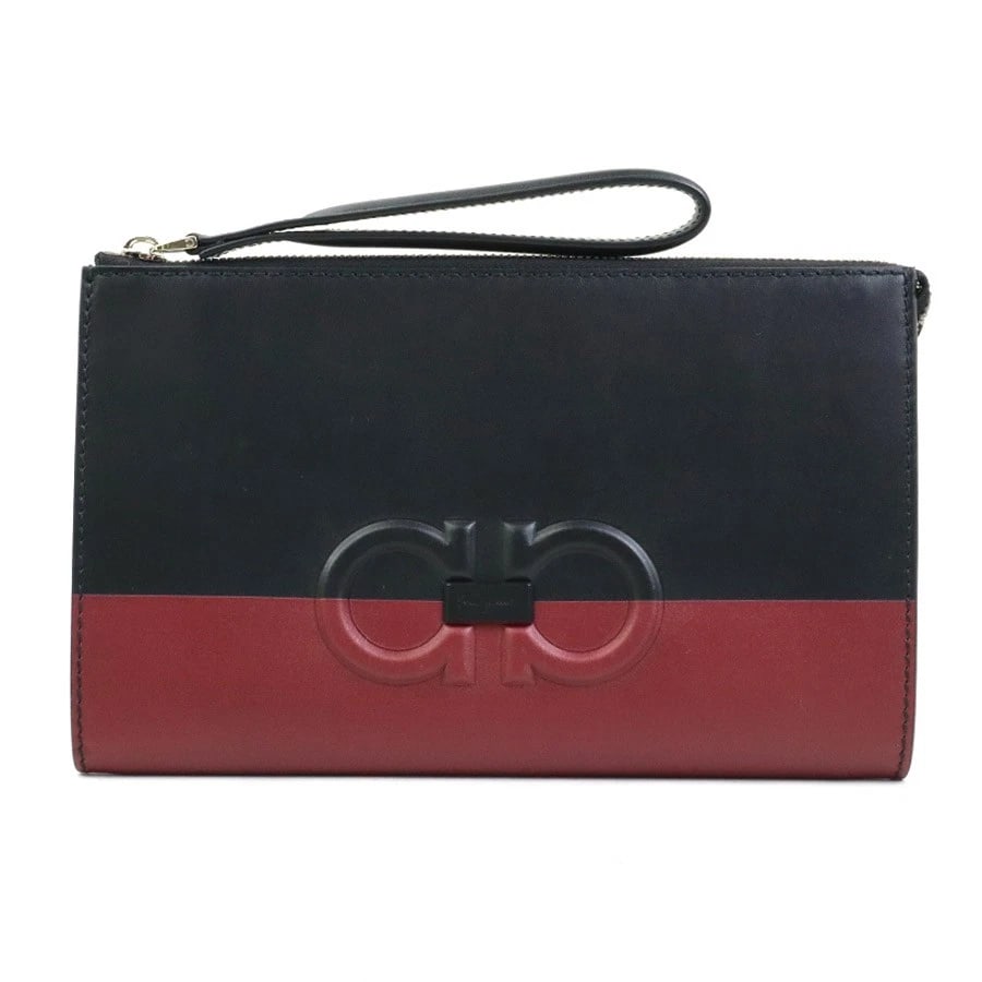 SALVATORE FERRAGAMO GANCINI CLUTCH BAG: Salvatore Ferragamo Gancini Clutch Bag Brand: Salvatore Ferragamo Type: Clutch bag Material: leather Color: Black X Dark Red Size: W:9.8inx H:5.9inx D:0.8in Accessories: None Accessories N