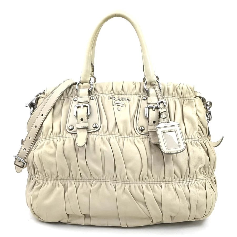 PRADA HANDBAG SHOULDER BAG BEIGE LEATHER: PRADA Handbag Shoulder Bag Beige Leather Brand: PRADA Type: Handbag Material: leather Color: Beige Size: W:13.0inx H:11.8inx D:6.3in Handle Length:13.2in Accessories: None Accessories Noti