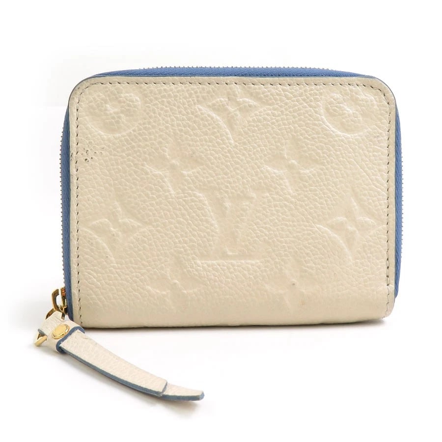 LOUIS VUITTON MONOGRAM EMPREINTE ZIPPY COIN PURSE: LOUIS VUITTON Monogram Empreinte Zippy Coin Purse Brand: LOUIS VUITTON Type: Coin case Material: Monogram Empreinte Leather Color: Off White/Blue Size: W:4.3inx H:3.1inx D:0.8in Accessories: None