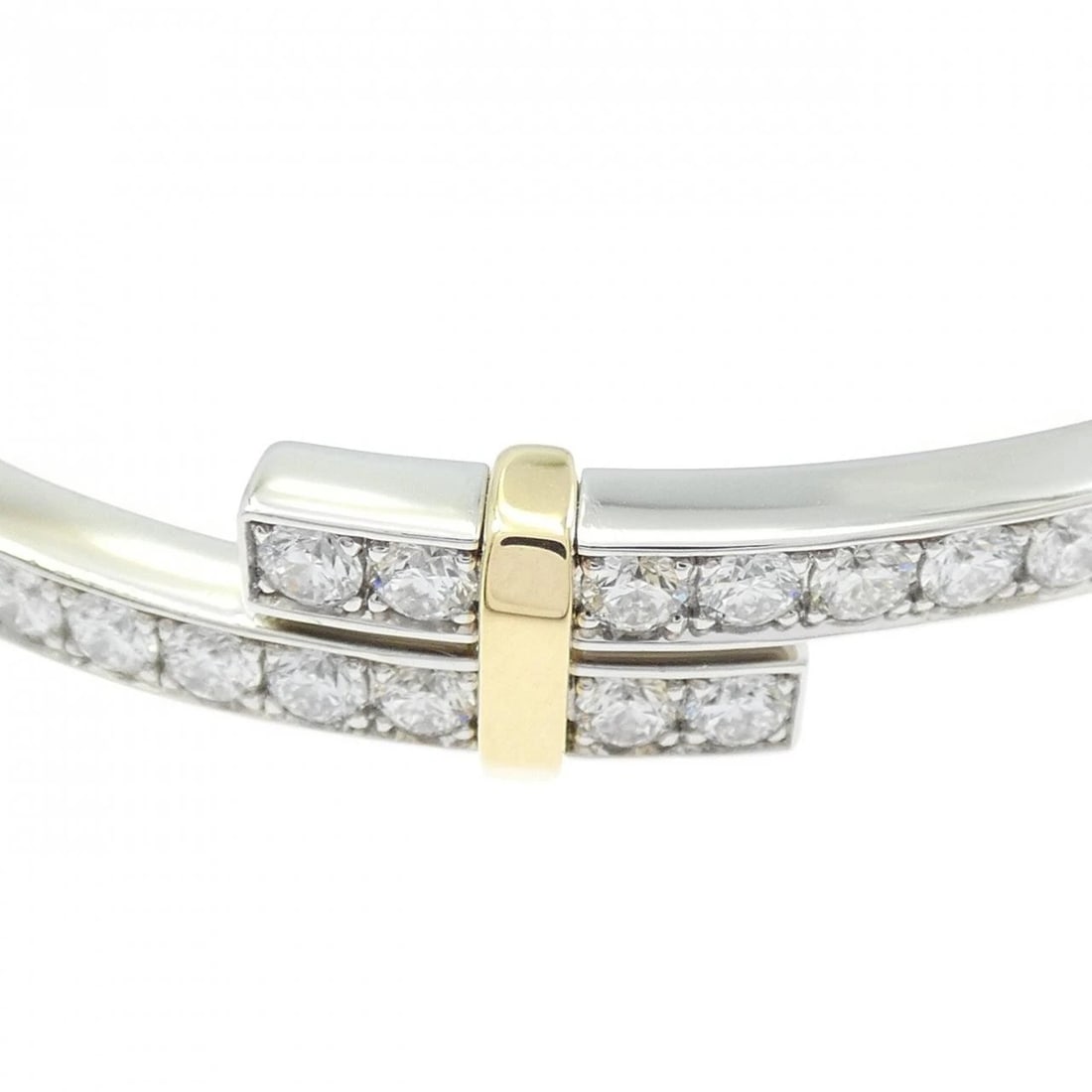 TIFFANY & CO. HINGE BYPASS BANGLE: TIFFANY & Co. Hinge Bypass Bangle Brand: TIFFANY&Co. Type: TIFFANY & Co. bracelet Material: Platinum 950/750 Yellow Gold, Main Stone/Creation Natural Color: Platinum Yellow Gold Size: Actual Size Max 