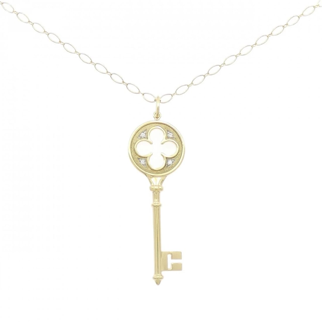 TIFFANY&CO. QUARTER FOIL KEY NECKLACE: TIFFANY&Co. Quarter Foil Key Necklace Brand: TIFFANY&Co. Type: TIFFANY&Co. Necklace Material: 750 yellow gold/750 white gold, Main Stone/Creation Natural Color: White Gold Yellow Gold Size: Actual Siz