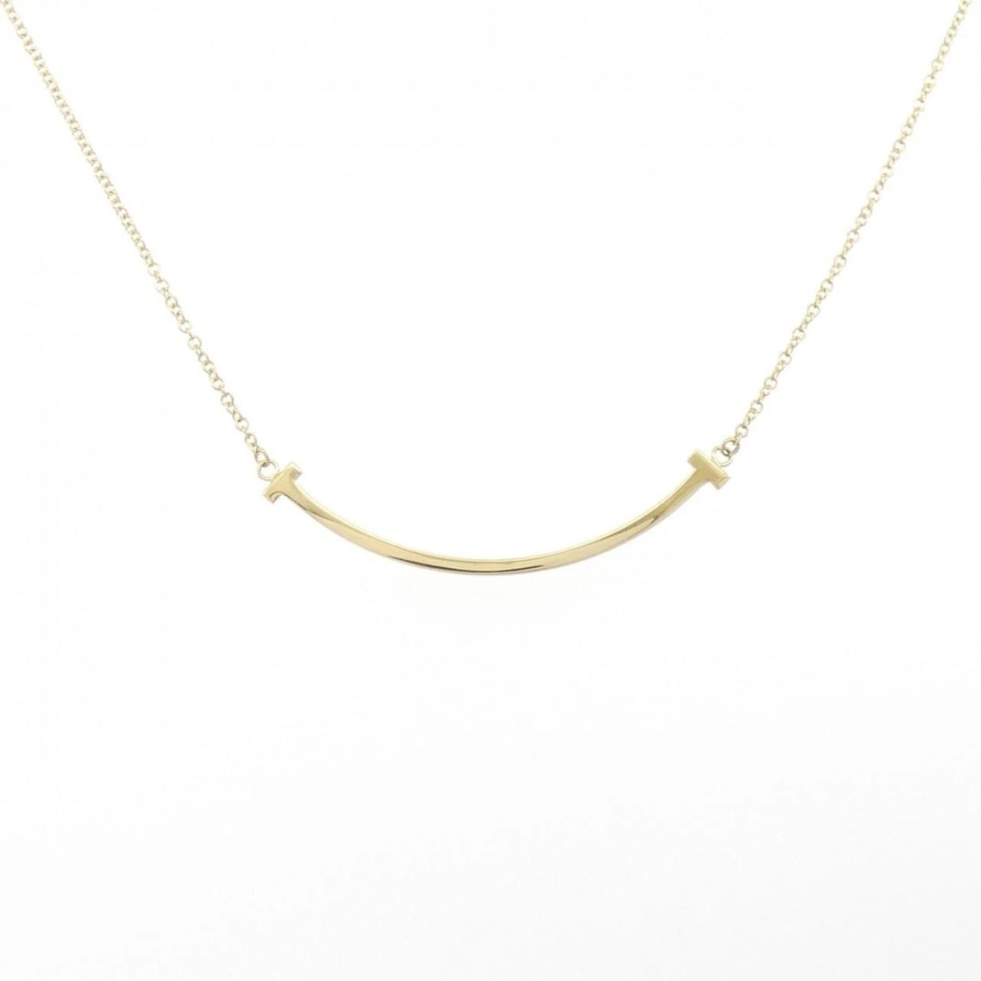 TIFFANY&CO. T SMILE SMALL NECKLACE: TIFFANY&Co. T Smile Small Necklace Brand: TIFFANY&Co. Type: TIFFANY&Co. Necklace Material: 750 yellow gold, Color: yellow gold Size: Actual Size Pendant length approx. x width approx.: 3.6mmx37.2mm