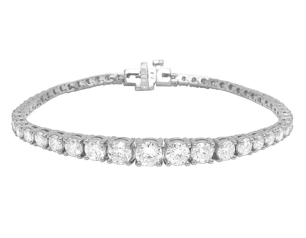 SOLITAIRES 50 POINTER GRADUATING TENNIS BRACELET 14K WHITE GOLD: Solitaires 50 Pointer Graduating Tennis Bracelet 14K White Gold Brand: None Type: Bracelet Material: 14K White Gold, Main Stone/Creation Natural Color: White Gold Size: Dimension 6 mm x 2.5 mm Length 