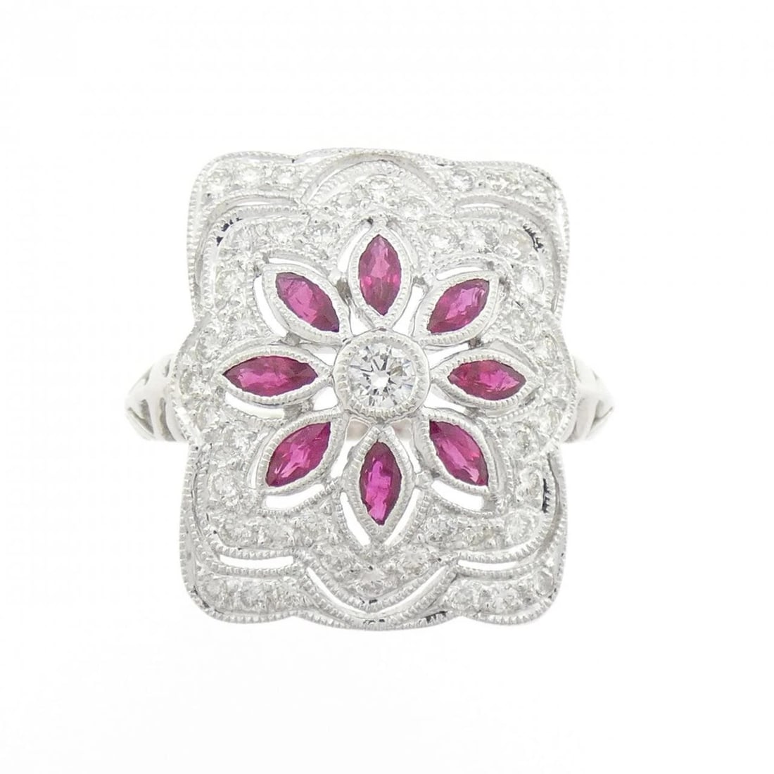PT900 FLOWER RUBY RING: PT900 Flower Ruby Ring Brand: Unbranded Type: Ring Material: PT900, Main Stone/Creation RubySide Stone Diamond Color: silver Size: 6.5 (US size) Accessories: None Accessories Notice: When purchasing