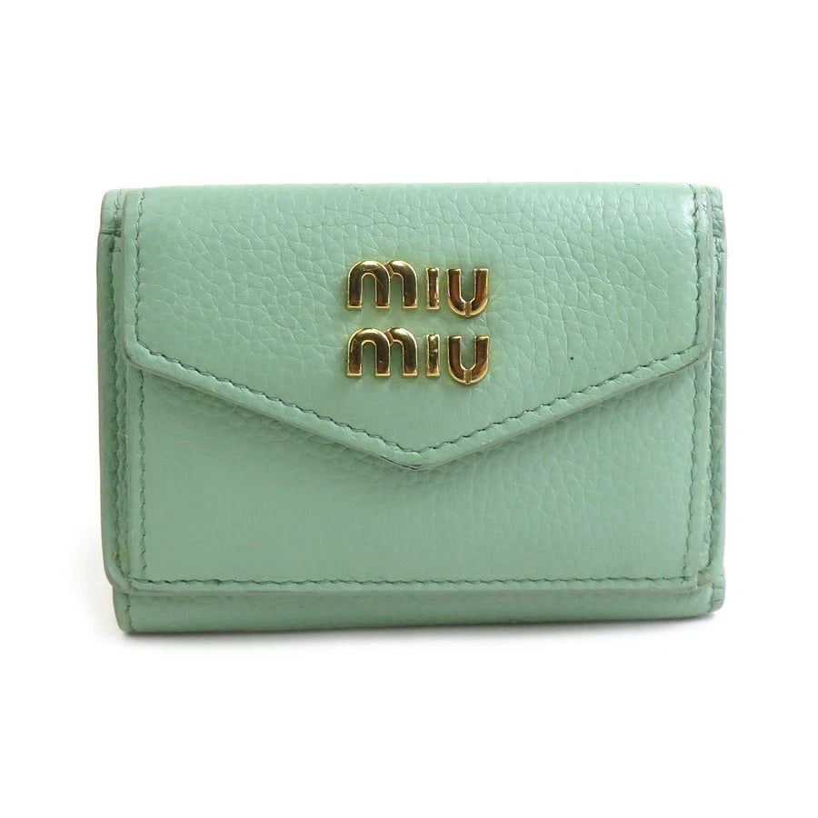 MIUMIU TRIFOLD WALLET GREEN LEATHER: MIUMIU Trifold Wallet Green Leather Brand: MIUMIU Type: Tri-fold wallet Material: Leather Color: Green Size: W:3.9inx H:2.6inx D:0.9in Accessories: None Accessories Notice: When purchasing pre-owned