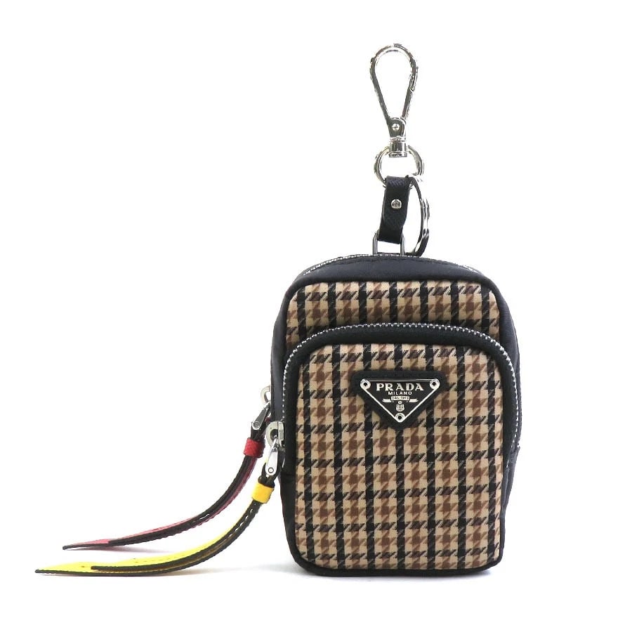 PRADA POUCH MULTICASE BROWN/BLACK NYLON/SILVERTONE: PRADA Pouch Multicase Brown/Black Nylon/Silvertone Brand: PRADA Type: Pouch Material: Nylon Color: Brown X Black Size: W:3.1inx H:3.9inx D:2.0in Accessories: None Accessories Notice: When