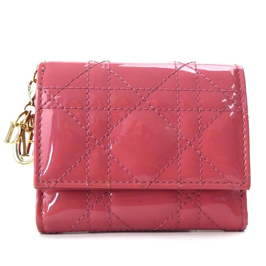 CHRISTIAN DIOR TRIFOLD WALLET PINK PATENT LEATHER: Christian Dior Trifold Wallet Pink Patent Leather Brand: Christian Dior Type: Tri-fold wallet Material: Patent Leather Color: Pink Size: W:3.9inx H:3.3inx D:1.2in Accessories: None Accesso