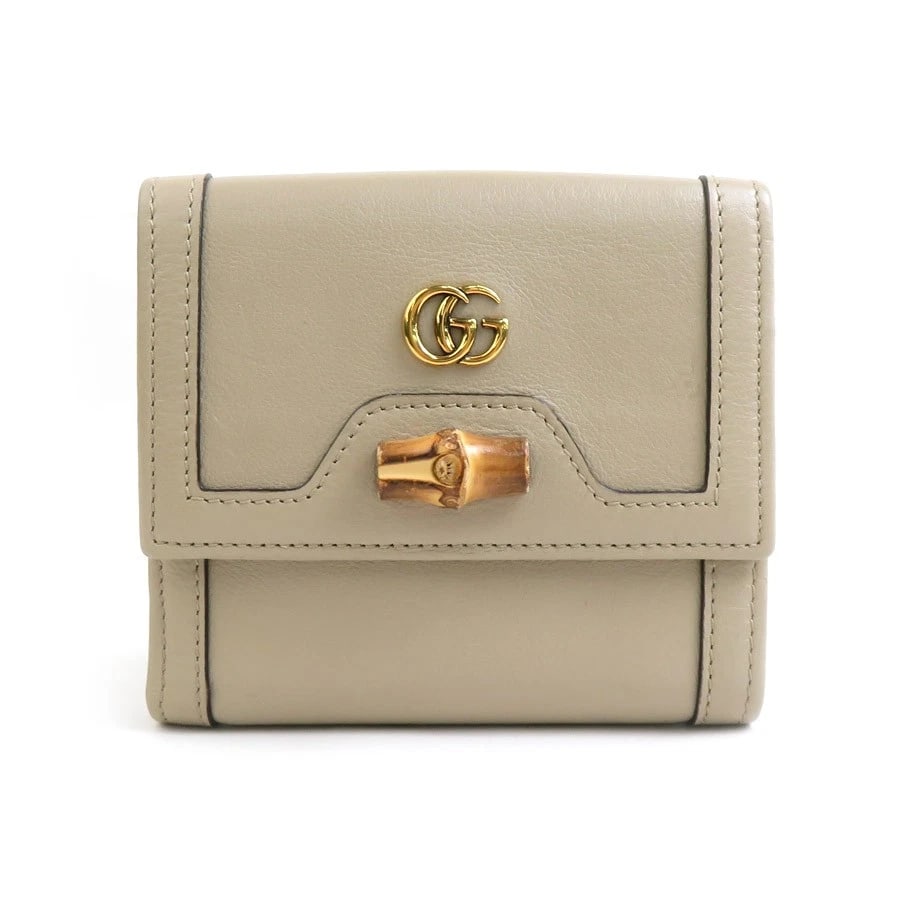 GUCCI GG MARMONT BIFOLD WALLET LEATHER: GUCCI GG Marmont Bifold Wallet Leather Brand: GUCCI Type: Bifold Wallet Material: Leather Color: Beige Size: W:4.7inx H:4.1inx D:1.0in Accessories: None Accessories Notice: When purchasing
