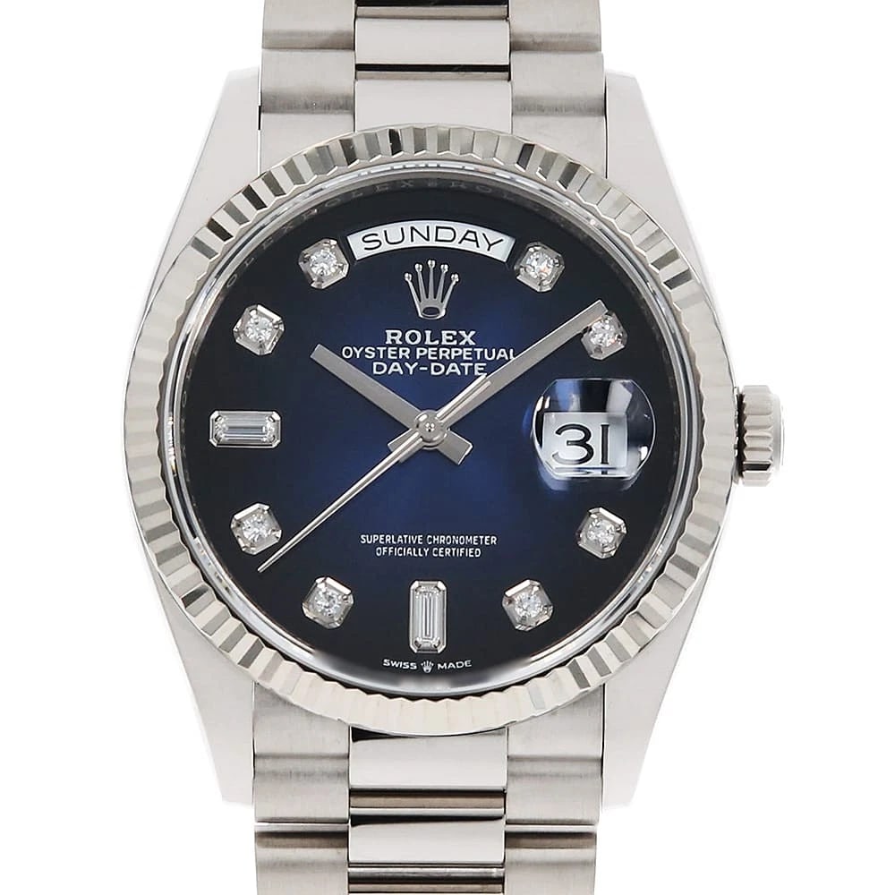 ROLEX DAY DATE DIAMOND BAGUETTE BLUE WATCH: ROLEX Day Date Diamond Baguette blue Watch Brand: ROLEX Type: Wrist watch Material: Band Material White Gold, Case Material White Gold Color: Dial Colour Blue Size: Case:W36mm Circumference of Wrist:1
