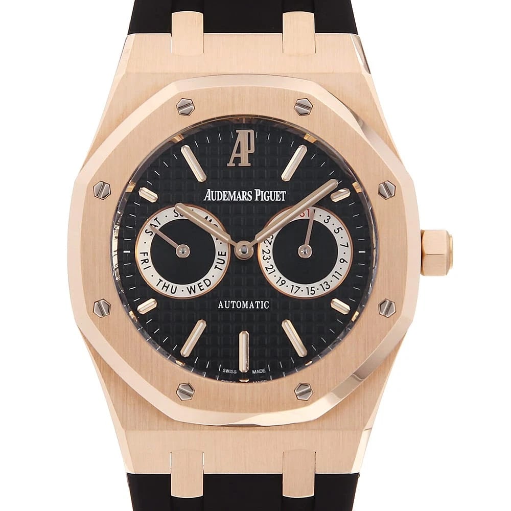 AUDEMARS PIGUET ROYAL OAK DAY-DATE WATCH: AUDEMARS PIGUET Royal Oak Day-Date Watch Brand: AUDEMARS PIGUET Type: Wrist watch Material: Band Material rubber, Case Material Pink gold Color: Dial Colour Black Size: Case:W39mm Accessories: None
