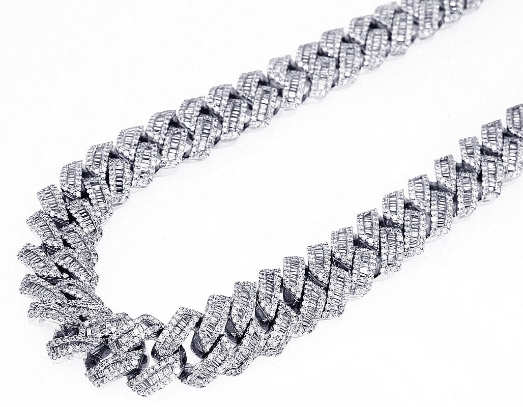 15MM BAGUETTE DIAMOND CUBAN CHAIN 10K WHITE GOLD: 15MM Baguette Diamond Cuban Chain 10K White Gold Brand: None Type: Necklace Material: 10K White Gold, Main Stone/Creation Natural Color: White Gold Size: Length 22" Width 15MM Accessories: None