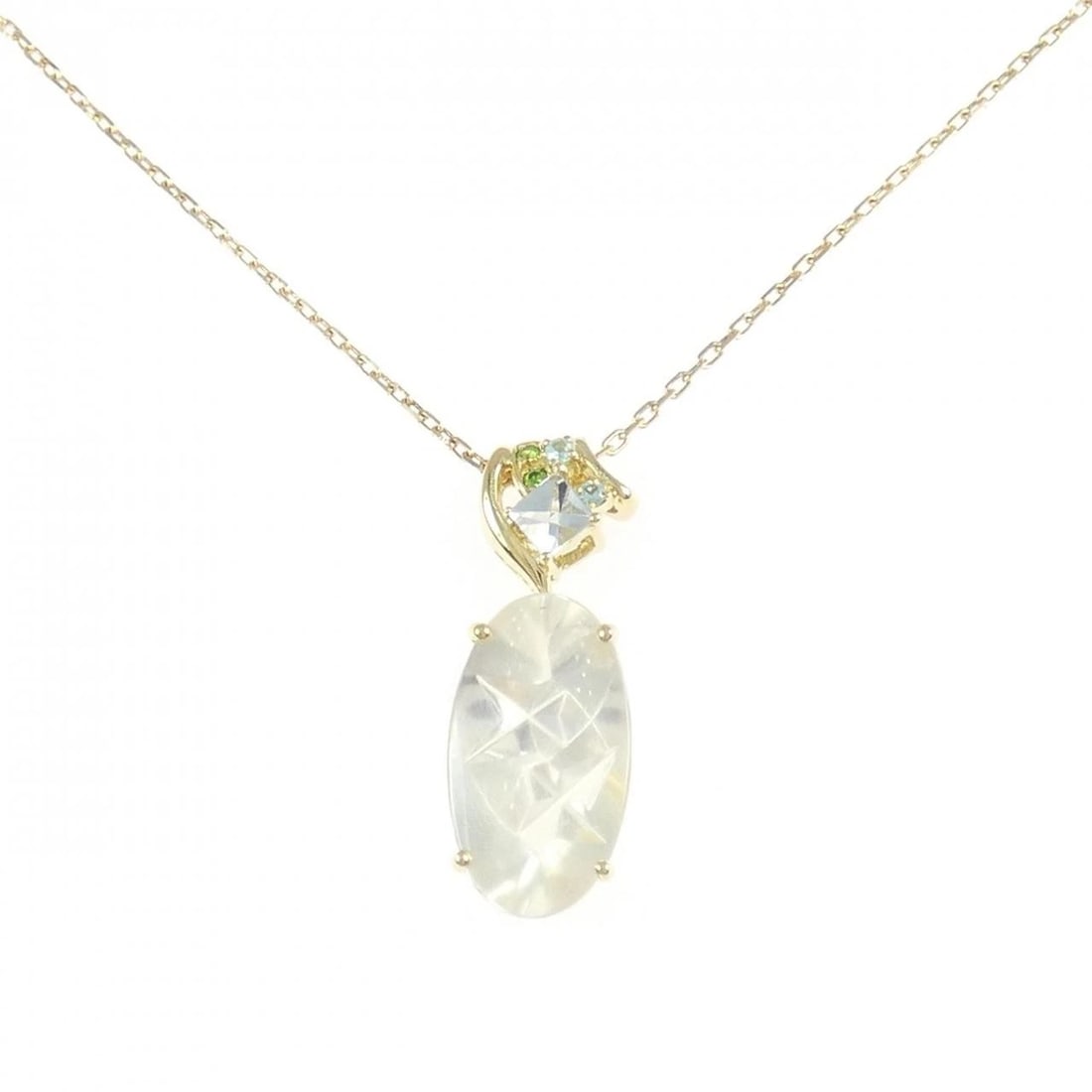 K18YG MOONSTONE NECKLACE: K18YG Moonstone Necklace Brand: Unbranded Type: Moonstone Necklace Material: K18YG, Main Stone/Creation Moonstone Secondary Stone Aquamarine/Tourmaline/Garnet Color: Yellow gold Size: Actual Size