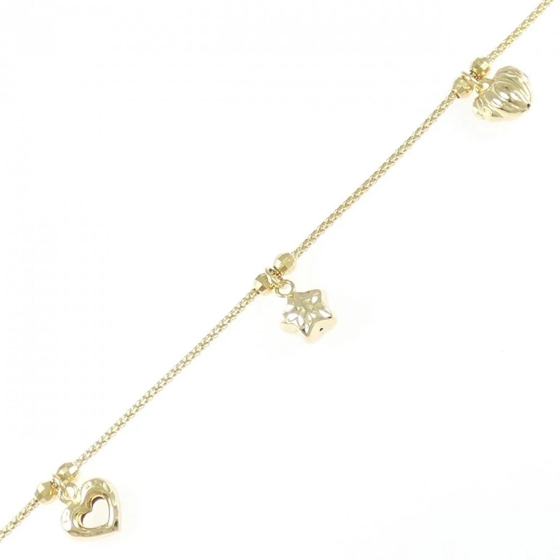 750YG HEART X STAR BRACELET: 750YG Heart x Star Bracelet Brand: Unbranded Type: Bracelet Material: 750YG, Color: YELLOW GOLD Size: 19cm Actual Size Max width approx.: 11.6mm Accessories: None Accessories Notice: When purchasing