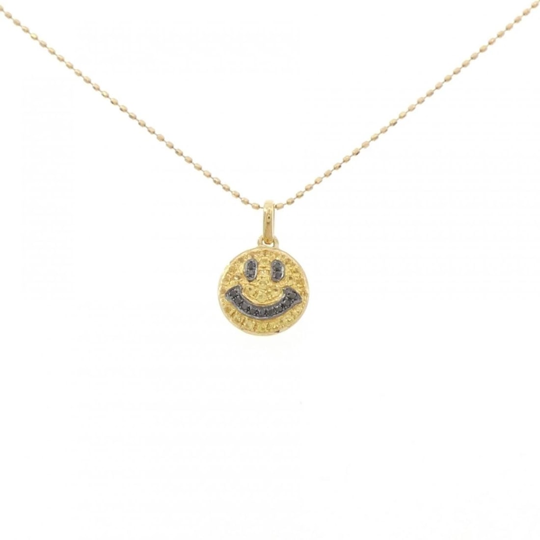 K18YG/K18BG SMILE SAPPHIRE NECKLACE: K18YG/K18BG Smile Sapphire Necklace Brand: Unbranded Type: Sapphire Necklace Material: K18YG/K18BG, Main Stone/Creation Sapphire Secondary stone Diamond Color: YG,BG Size: 46cm Actual Size Pendant