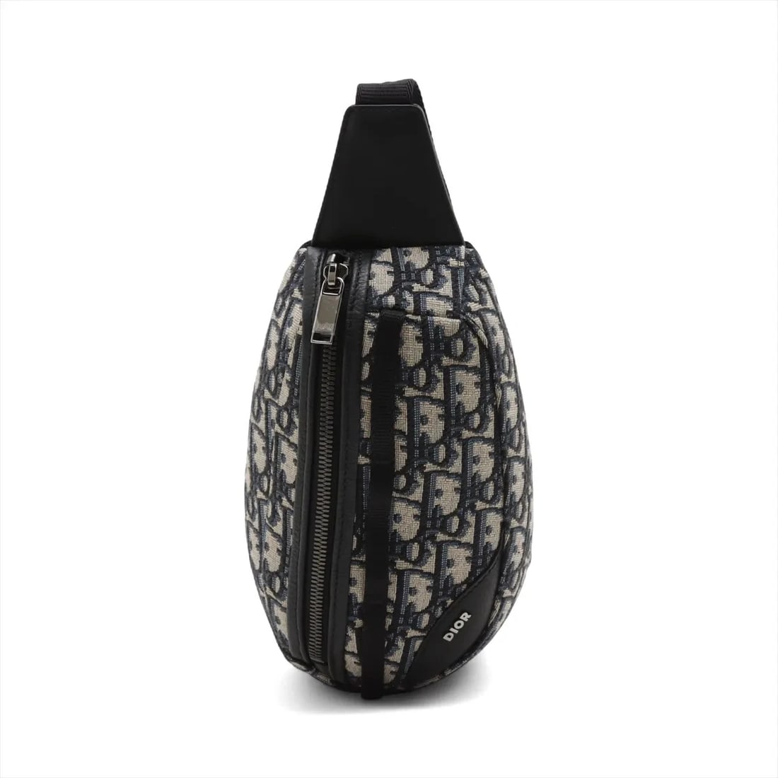 DIOR OBLIQUE CANVAS X LEATHER SLING BACKPACK: Dior Oblique canvas x leather Sling backpack Brand: Dior Type: Waist pouch/Crossbody bag Material: Canvas & Leather Color: Navy Blue Size: Height:4.9inchLength:8.7inchDepth:1.8inch Accessories: No