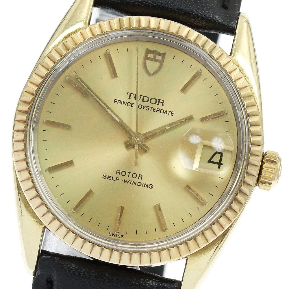 TUDOR PRINCE OYSTER DATE YG BEZEL AUTOMATIC WATCH: TUDOR Prince Oyster Date YG Bezel Automatic Watch Brand: TUDOR Type: Wristwatch Material: Band Material leather, Case Material Stainless Steel/Gold Plated/YG Color: Band Color black, Dial Colorgold, C