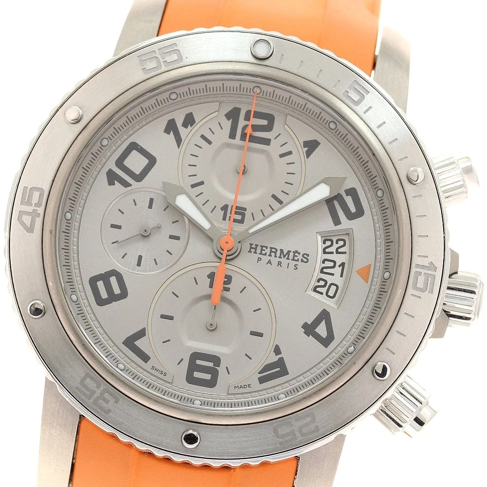 HERMES CLIPPER MECHANIC CHRONOGRAPH AUTOMATIC WATCH: HERMES Clipper mechanic Chronograph Automatic Watch Brand: HERMES Type: Wristwatch Material: Band Material rubber, Case Material Stainless Steel / Titanium Color: Band Color Orange, Dial Colorgray,