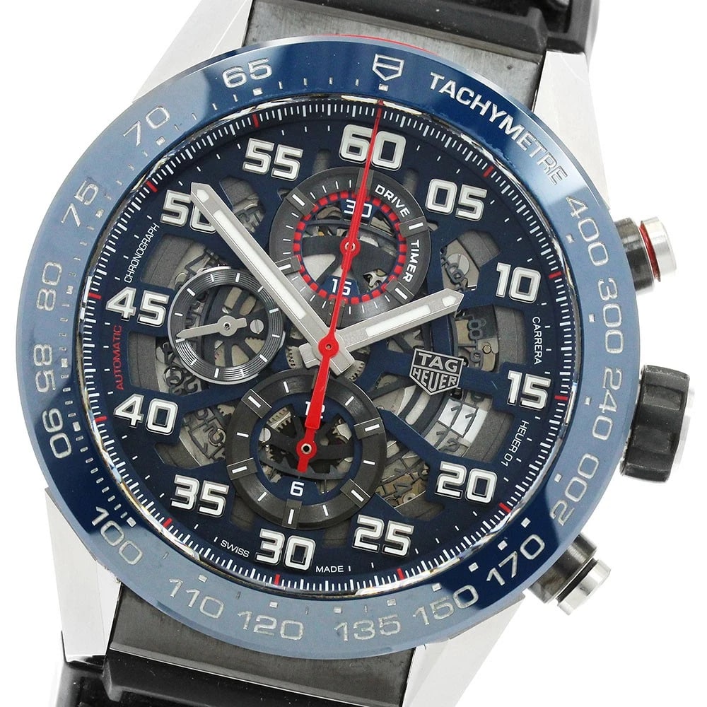 TAG HEUER CARRERA CALIBER RED BULL WATCH: TAG HEUER Carrera Caliber Red bull Watch Brand: TAG HEUER Type: Wristwatch Material: Band Material Leather / Rubber, Case Material Stainless Steel Color: Band Color Navy / Black, Dial ColorNavy /
