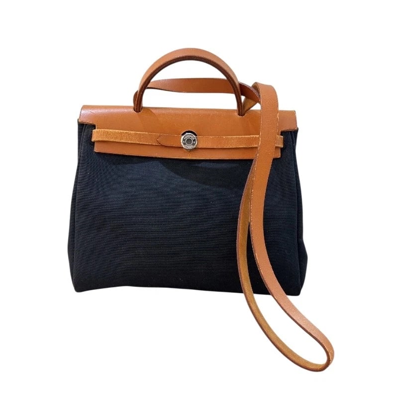 HERMES HERBAGPM HANDBAG: HERMES HerbagPM Handbag Brand: HERMES Type: Handbag Material: Towar Color: Black Gold SilverHardware Size: W30cm x H25cmx D9cm W11.8 x H9.8x D3.5inch Accessories: None Accessories Notice: When