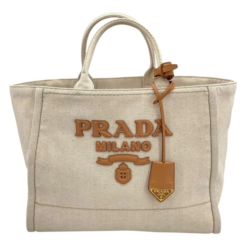 PRADA CANAPA LARGE TOTE BAG: PRADA Canapa large Tote Bag Brand: PRADA Type: Tote Bag Material: canvas Color: beige Size: W44cm x H30cmx D20cmW17.3 x H11.8x D7.9inch Accessories: None Accessories Notice: When purchasin