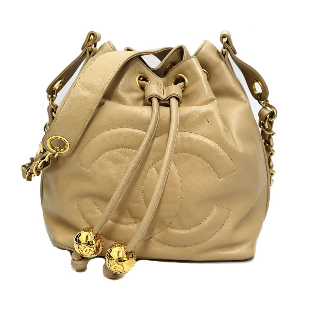 CHANEL DRAWSTRING SHOULDER BAG LEATHER BEIGE WITH DUST BAG POUCH: Chanel Drawstring Shoulder Bag Leather Beige with Dust Bag Pouch Brand: CHANEL Type: Handbag Material: leather Color: beige Size: W20cm x H28cm x D22cm Accessories: None Accessories Notice