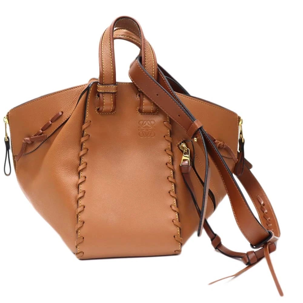 LOEWE HAMMOCK SMALL 2WAY BAG BROWN SOFT GRAIN CALF WITH SHOULDER STRAP: Loewe Hammock Small 2WAY Bag Brown Soft Grain Calf with Shoulder Strap Brand: LOEWE Type: Handbag Material: Soft grain calf Color: Brown tones Size: W28cm x H23cm x D14cm Accessories: None