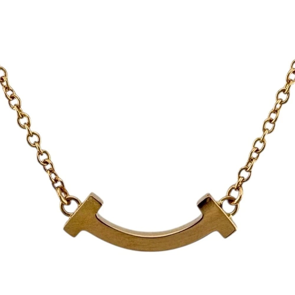 TIFFANY & CO. T SMILE NECKLACE 18K PINK GOLD: Tiffany & Co. T Smile Necklace 18K Pink Gold Brand: Tiffany & Co. Type: Necklace Material: 18K Pink Gold, Color: Pink Gold Size: Chain Length: Approx. 17.9 inches (45.5 cm, including pendant) AdjUS te