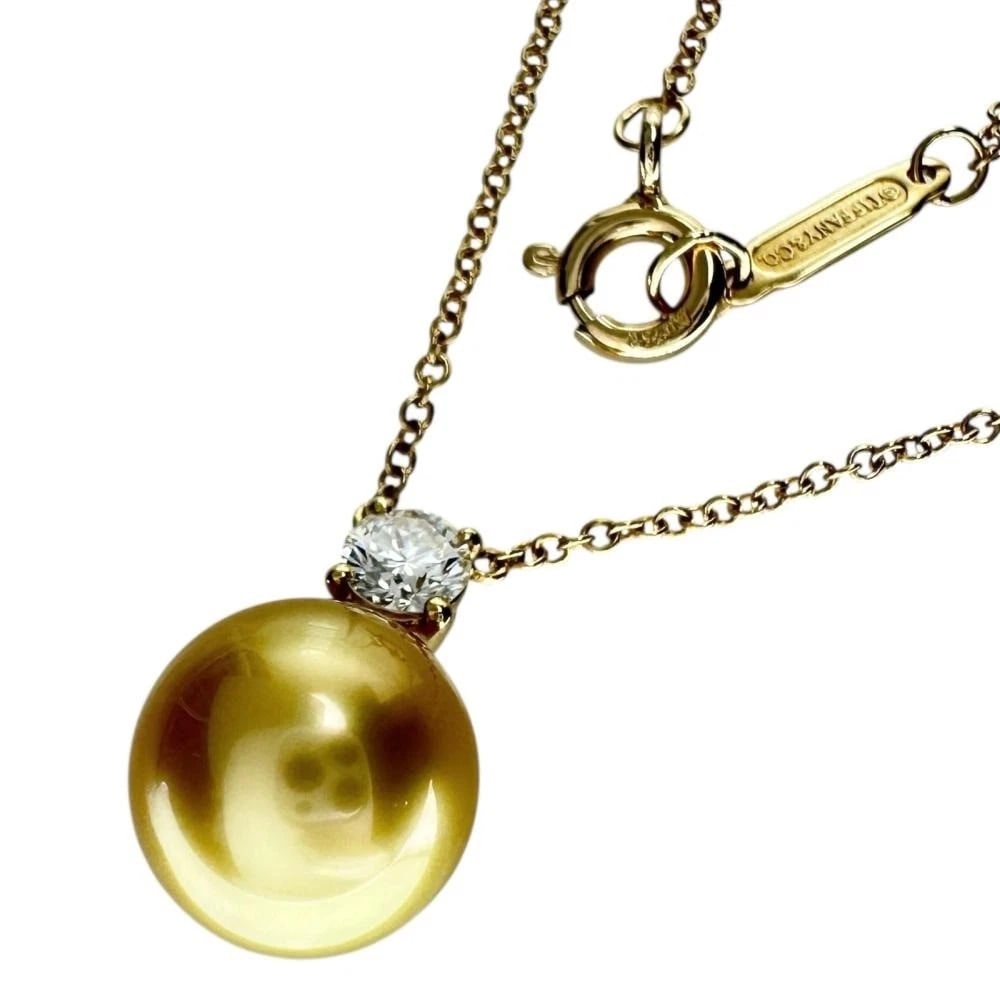 TIFFANY & CO. SOUTH SEA GOLDEN PEARL & DIAMOND NECKLACE 18K GOLD: Tiffany & Co. South Sea Golden Pearl & Diamond Necklace 18K Gold Brand: Tiffany & Co. Type: Necklace Material: 18K Yellow Gold, Main Stone/Creation South Sea Golden Pearl Secondary Stone: Diamond Colo