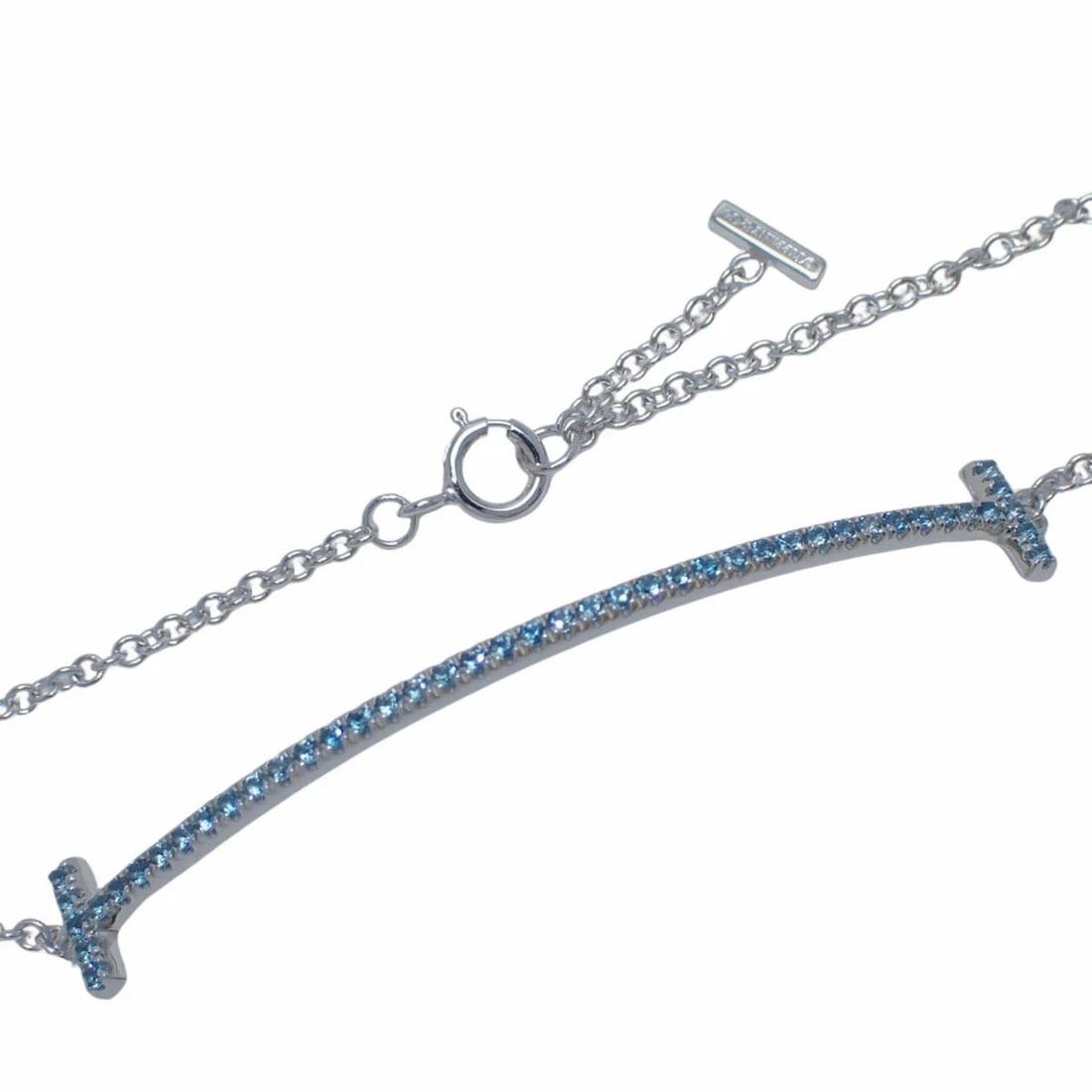 TIFFANY & CO. T SMILE BRACELET 18K WHITE GOLD BLUE TOPAZ: Tiffany & Co. T Smile Bracelet 18K White Gold Blue Topaz Brand: Tiffany & Co. Type: Bracelet Material: 18k White Gold, Color: White Gold Size: Length: 7.28 in (18.5 cm) Inner Circumference: Approx. 6.