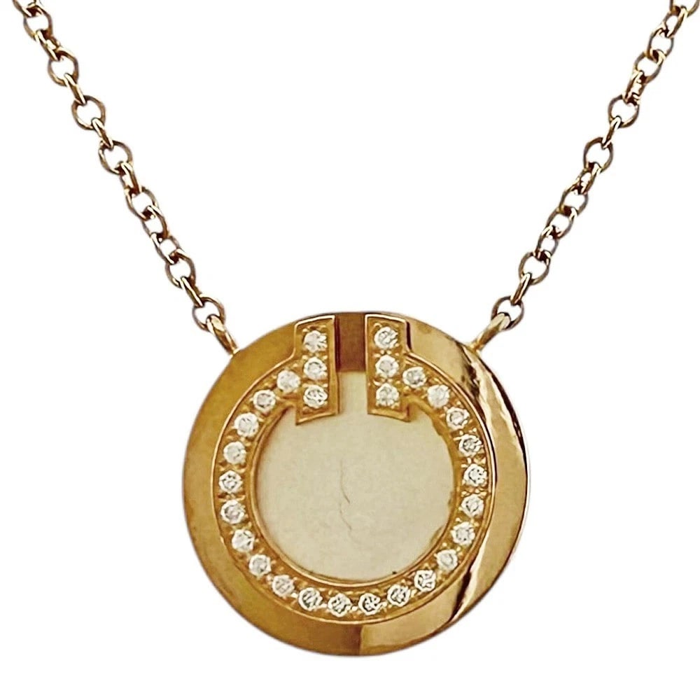 TIFFANY & CO. T CIRCLE NECKLACE DIAMOND MOTHER OF PEARL 18K PINK GOLD: Tiffany & Co. T Circle Necklace Diamond Mother of Pearl 18K Pink Gold Brand: Tiffany & Co. Type: Necklace Material: 18k Pink Gold, Main Stone/Creation Diamond Secondary Stone: Mother of Pearl Color: P