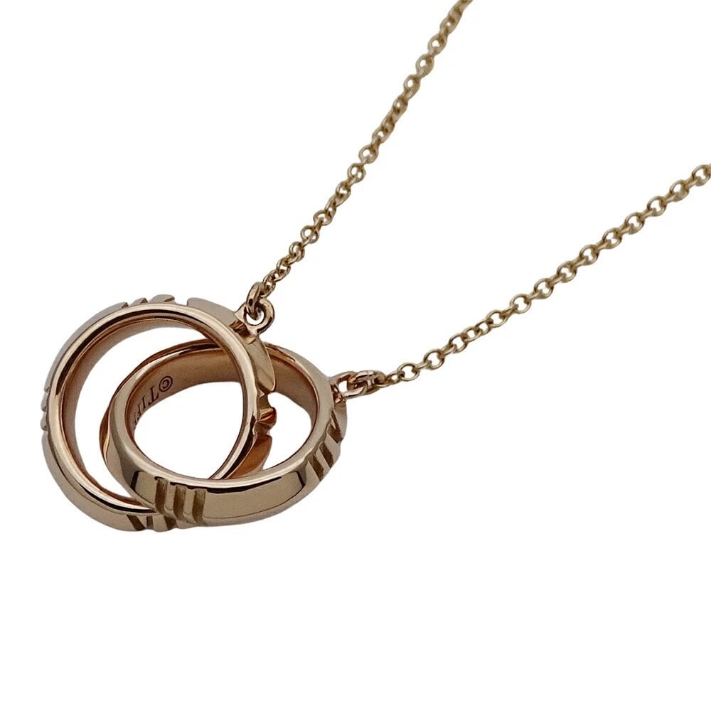 TIFFANY & CO ATLAS X INTERLOCKING NECKLACE 18K PINK GOLD: Tiffany & Co Atlas X Interlocking Necklace 18K Pink Gold Brand: Tiffany & Co. Type: Necklace Material: 18k Pink Gold, Color: Size: Diameter: approx. 0.49 in (12.4 mm) Width: approx. 0.11 in (2.7 mm ea