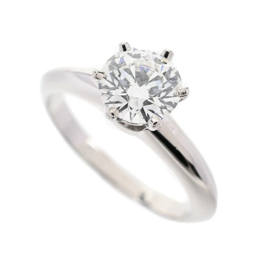 TIFFANY & CO DIAMOND SOLITAIRE RING: Tiffany & Co Diamond Solitaire Ring Brand: Tiffany & Co. Type: Ring Material: Platinum950, Main Stone/Creation Natural Color: Platinum Size: US 4.25 Accessories: None Accessories Notice: W
