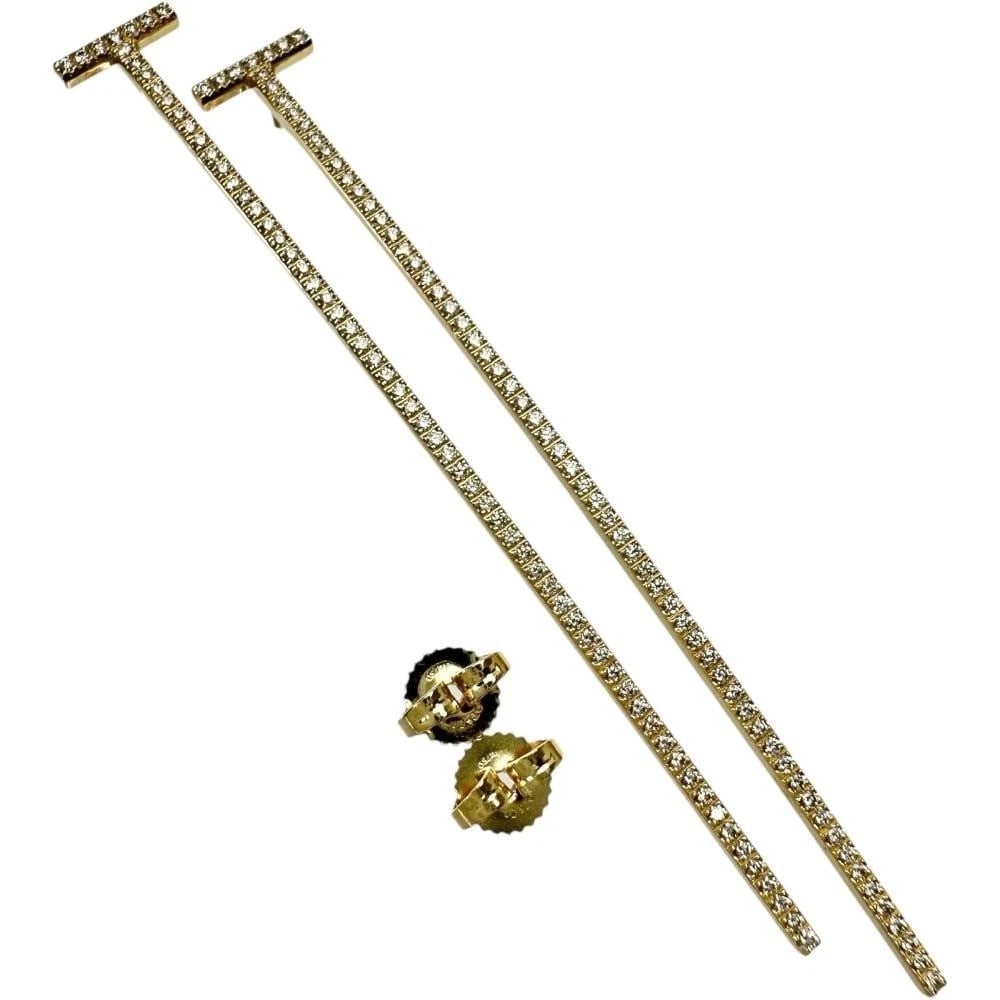 TIFFANY & CO. EARRINGS 18K YELLOW GOLD: Tiffany & Co. Earrings 18K Yellow Gold Brand: Tiffany & Co. Type: Earrings Material: 18k Yellow Gold, Main Stone/Creation Natural Color: Yellow Gold Size: Length: Approx. 2.74 in (69.5 mm) Width: Appr