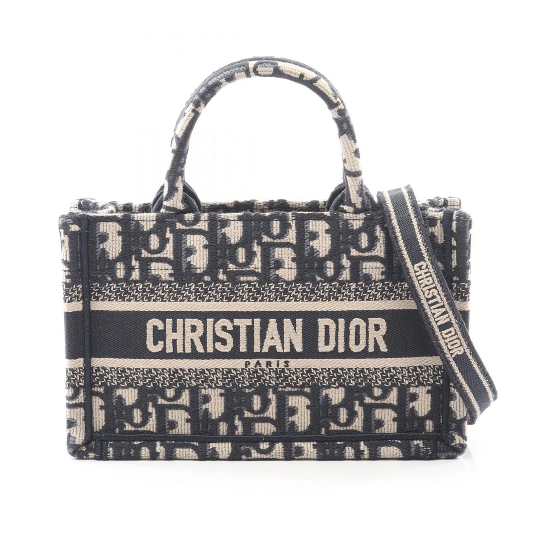 CHRISTIAN DIOR BOOK TOTE MINI CROSSBODY HAND BAG: Christian Dior BOOK TOTE Mini crossbody hand Bag Brand: Dior Type: Tote Bag Material: canvas Color: Beige??ish colors × Navy??ish colors Size: (H:5.1" x W:8.3" x D:3.1") Accessories: None