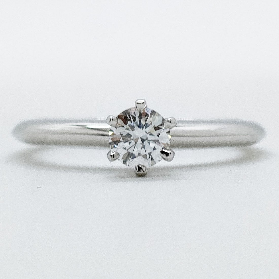 TIFFANY AND CO. RING SOLITAIRE NATURAL DIAMOND PLATINUM: Tiffany and Co. Ring Solitaire Natural Diamond Platinum Brand: Tiffany and Co. Type: Ring Material: Platinum, Color: Platinum Size: US 6 1/4 Accessories: None Accessories Notice: When purchasing