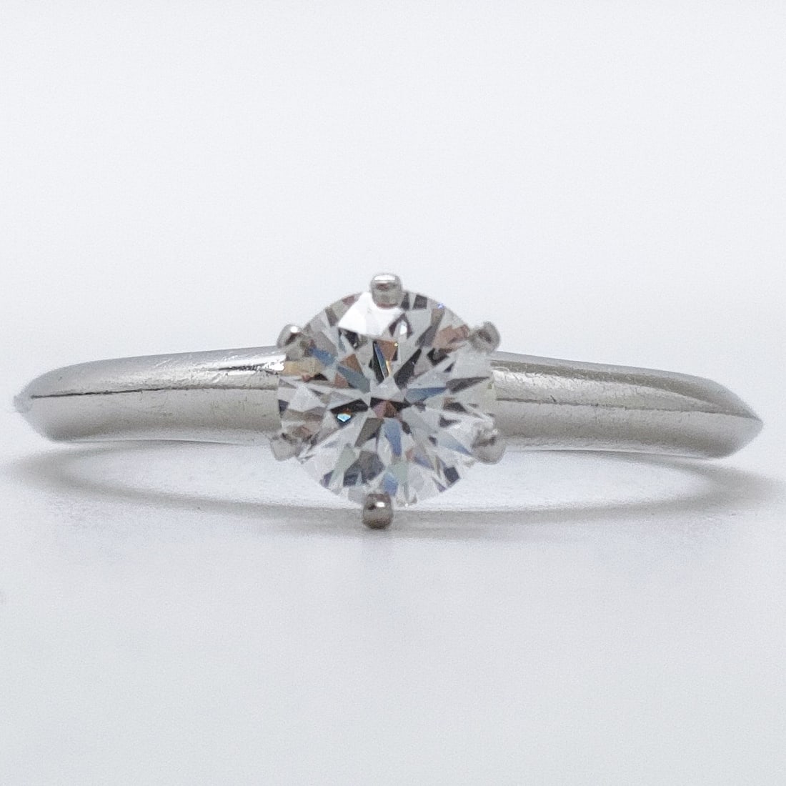 TIFFANY AND CO. RING SOLITAIRE NATURAL DIAMOND PLATINUM: Tiffany and Co. Ring Solitaire Natural Diamond Platinum Brand: Tiffany and Co. Type: Ring Material: Platinum, Color: Platinum Size: US 7 1/2 Accessories: None Accessories Notice: When purchasing