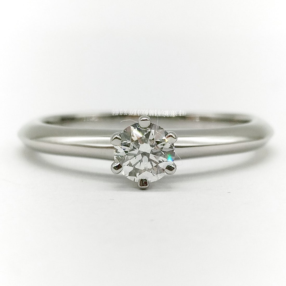 TIFFANY AND CO. RING SOLITAIRE NATURAL DIAMOND PLATINUM: Tiffany and Co. Ring Solitaire Natural Diamond Platinum Brand: Tiffany and Co. Type: Ring Material: Platinum, Color: Platinum Size: US 5 3/8 Accessories: None Accessories Notice: When purchasing