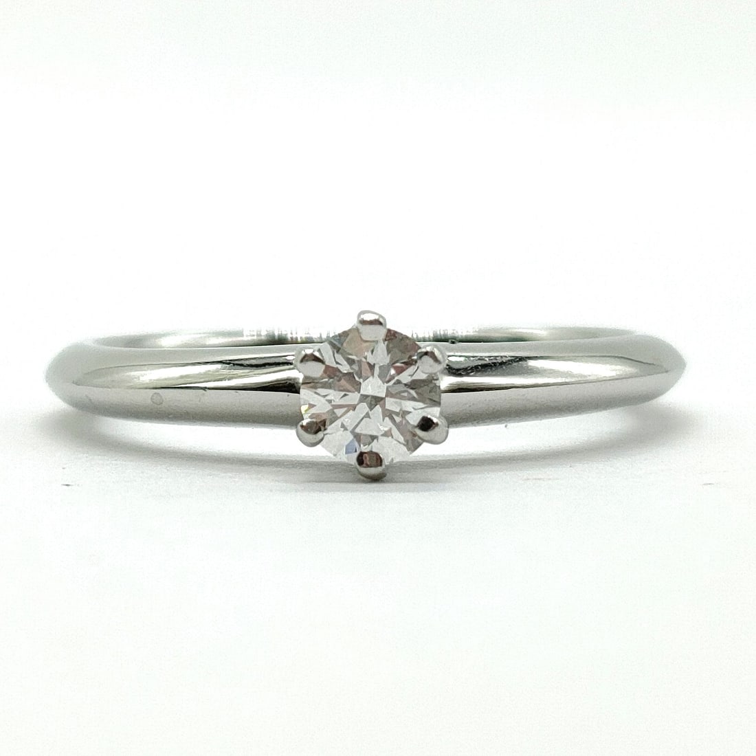 TIFFANY AND CO. RING SOLITAIRE NATURAL DIAMOND: Tiffany and Co. Ring Solitaire Natural Diamond Brand: Tiffany and Co. Type: Ring Material: Platinum, Color: Platinum Size: US 4 1/2 Accessories: None Accessories Notice: When purchasing pr