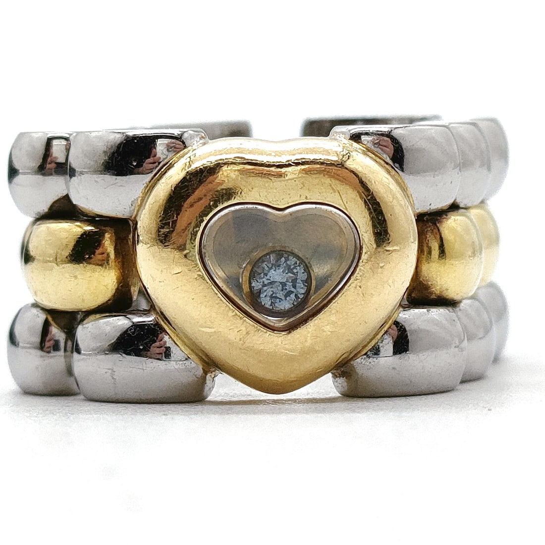 CHOPARD RING HAPPY DIAMOND GOLD STAINLESS STEEL: Chopard Ring Happy Diamond Gold Stainless Steel Brand: Chopard Type: Ring Material: Gold X Stainless steel, Color: Silver Size: US 7 Accessories: None Accessories Notice: When purchasing p