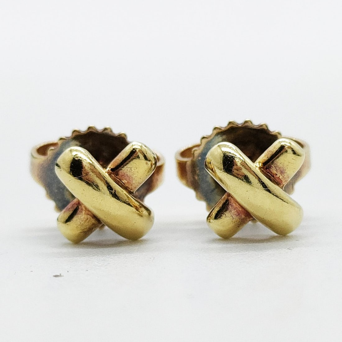 TIFFANY AND CO. PIERCED EARRING CROSS STITCH GOLD: Tiffany and Co. Pierced Earring Cross stitch Gold Brand: Tiffany and Co. Type: Pierced Earring Material: Gold, Color: Yellow Gold Size: None Accessories: None Accessories Notice: When purc